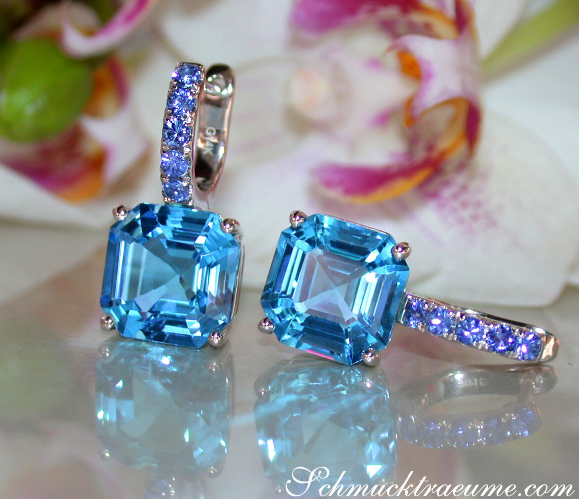 Blautopas-Ohrringe mit Saphiren auf glänzender Oberfläche