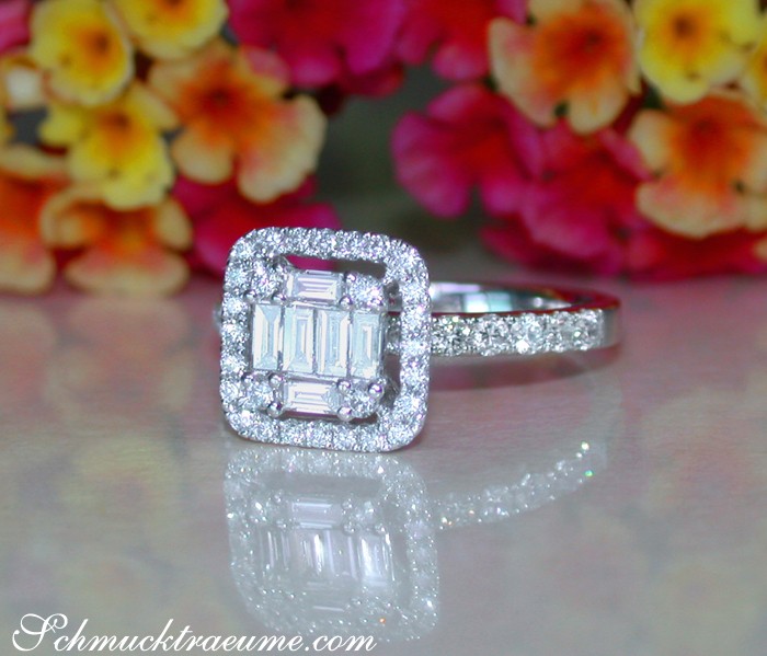 Femininer Diamant-Verlobungsring mit Baguette-Schliff und Brillanten-Beistecking, auf glänzender Oberfläche.