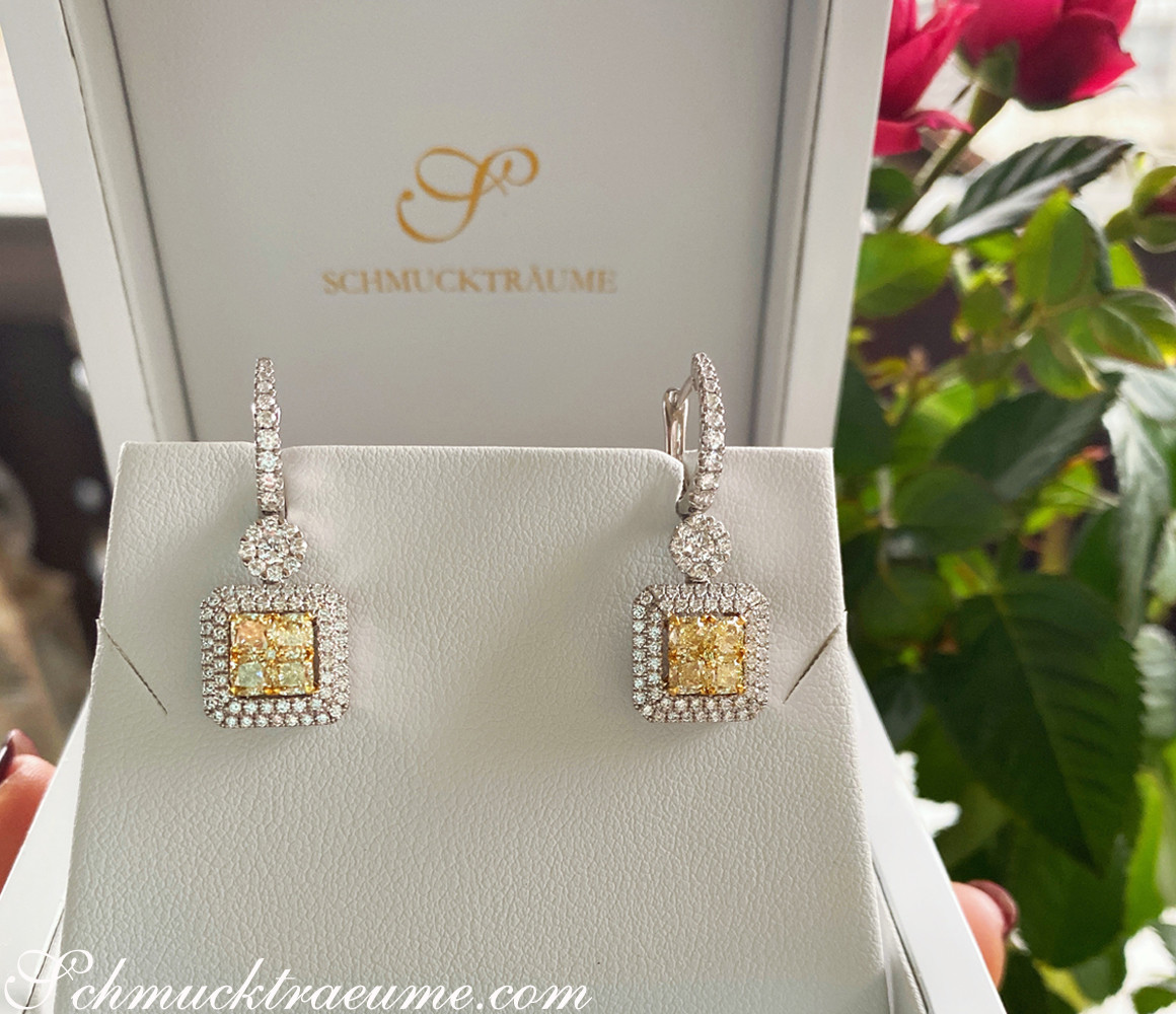 Edle gelbe Diamanten-Ohrhänger mit Brillanten in Weißgold & Gelbgold 750, präsentiert in luxuriösem Ambiente.