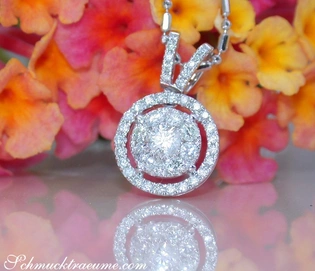 Diamanten-Anhänger mit 0.440 Karat W SI2 in Weißgold 750, umgeben von farbenfrohen Blumen.