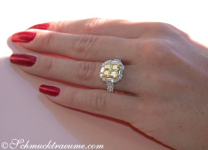 Erstklassiger gelber Diamanten-Ring mit Brillanten auf Hand, rote Nagelkunst