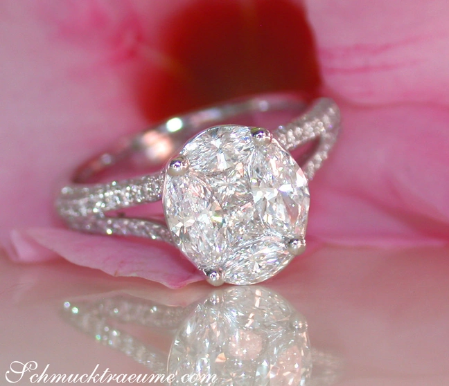 Weißgoldring mit ovalen Diamanten auf rosafarbenem Hintergrund Weißgoldring mit ovalen Diamanten auf rosafarbenem Hintergrund