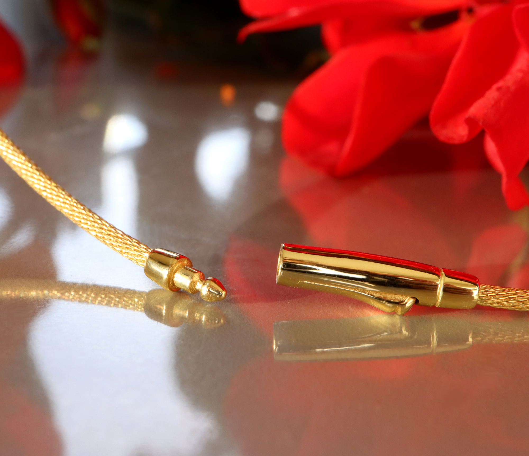 Goldkette aus Gelbgold 750, Detailaufnahme mit glänzenden Enden