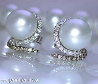 Südseeperlen-Ohrstecker in Weißgold mit 0.850 Karat naturbraunen & weißen Brillanten